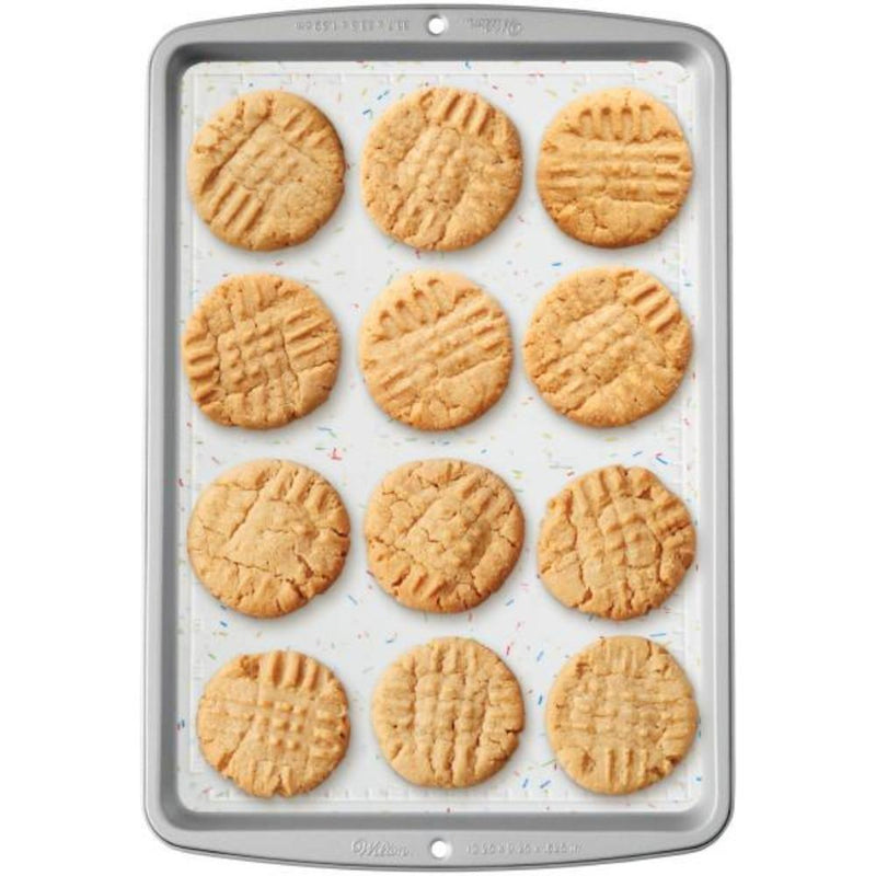 Peanut butter cookies on white silicone baking mat
